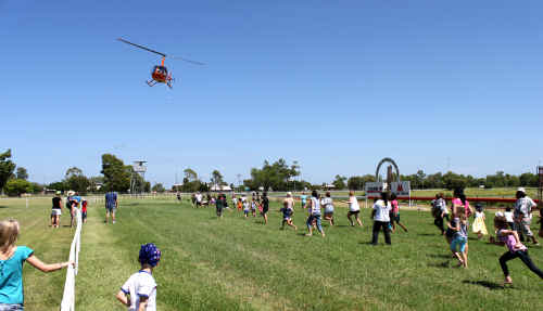 ABOVE: A helicopter flies in treats for the children. sg-260111-045 ABOVE: A helicopter flies in treats for the children. sg-260111-045